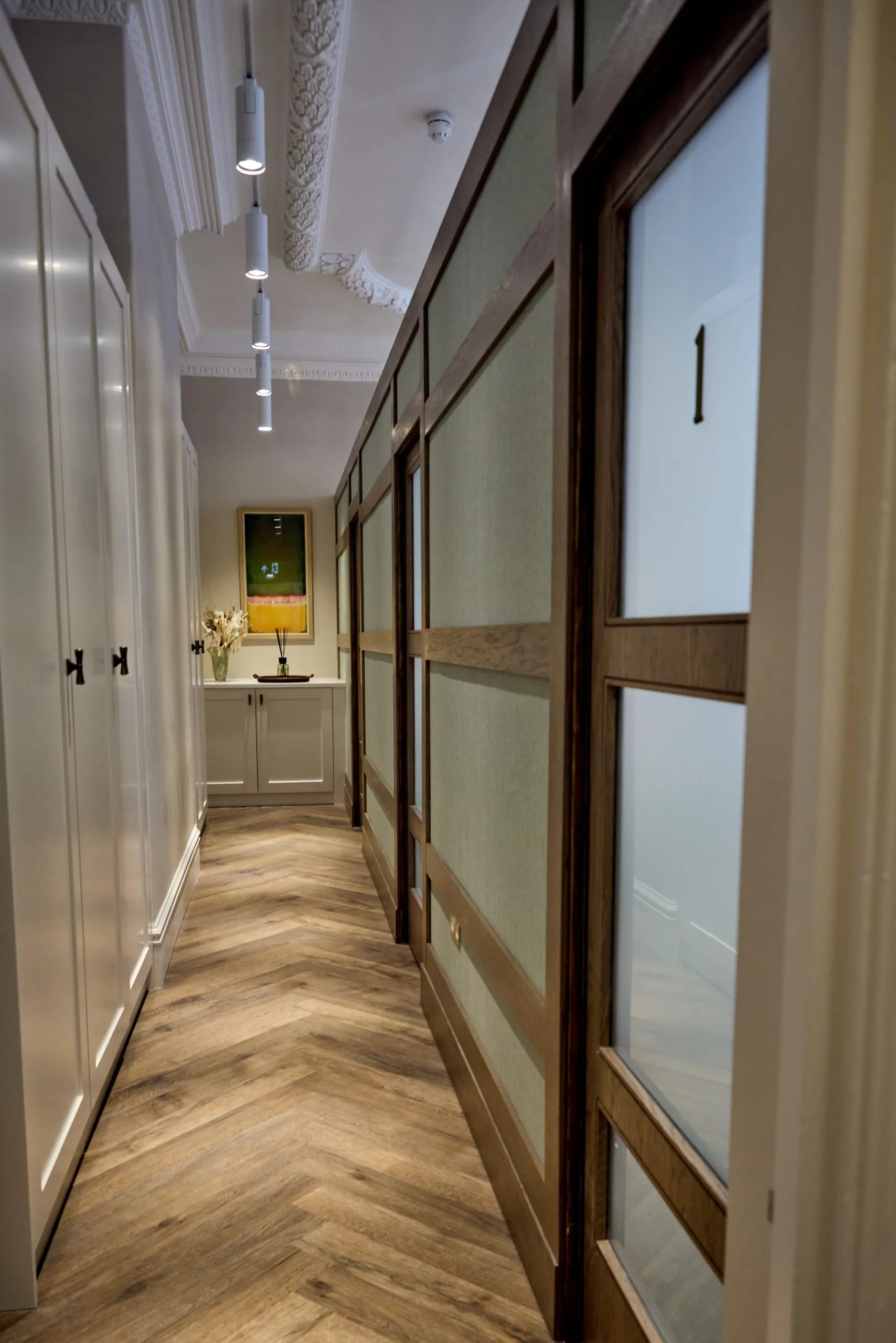 Corridor with bespoke glazed screens at Union Quay Dental, Tynemouth
