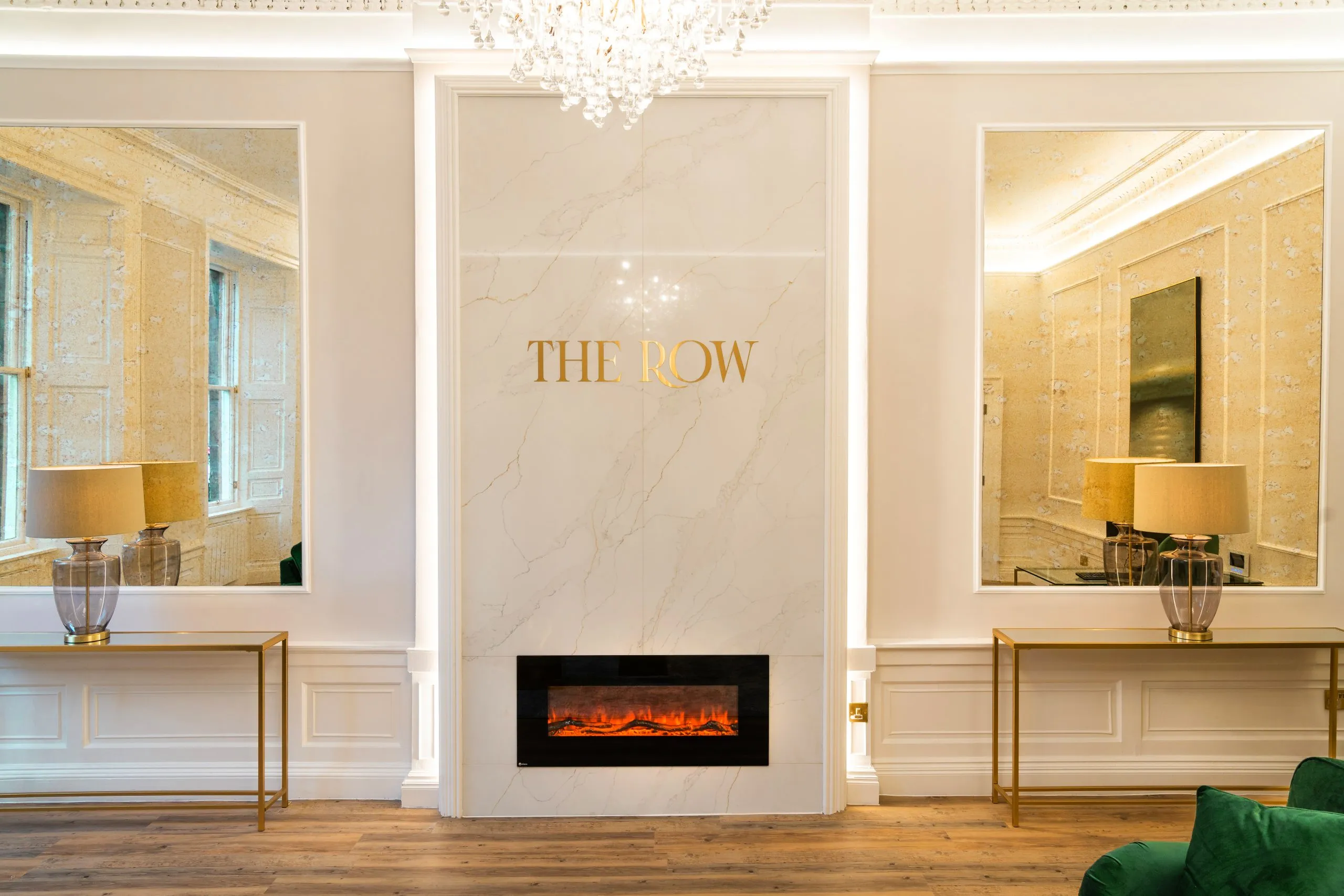 Branded fireplace wall in the waiting lounge at The Row, Edinburgh