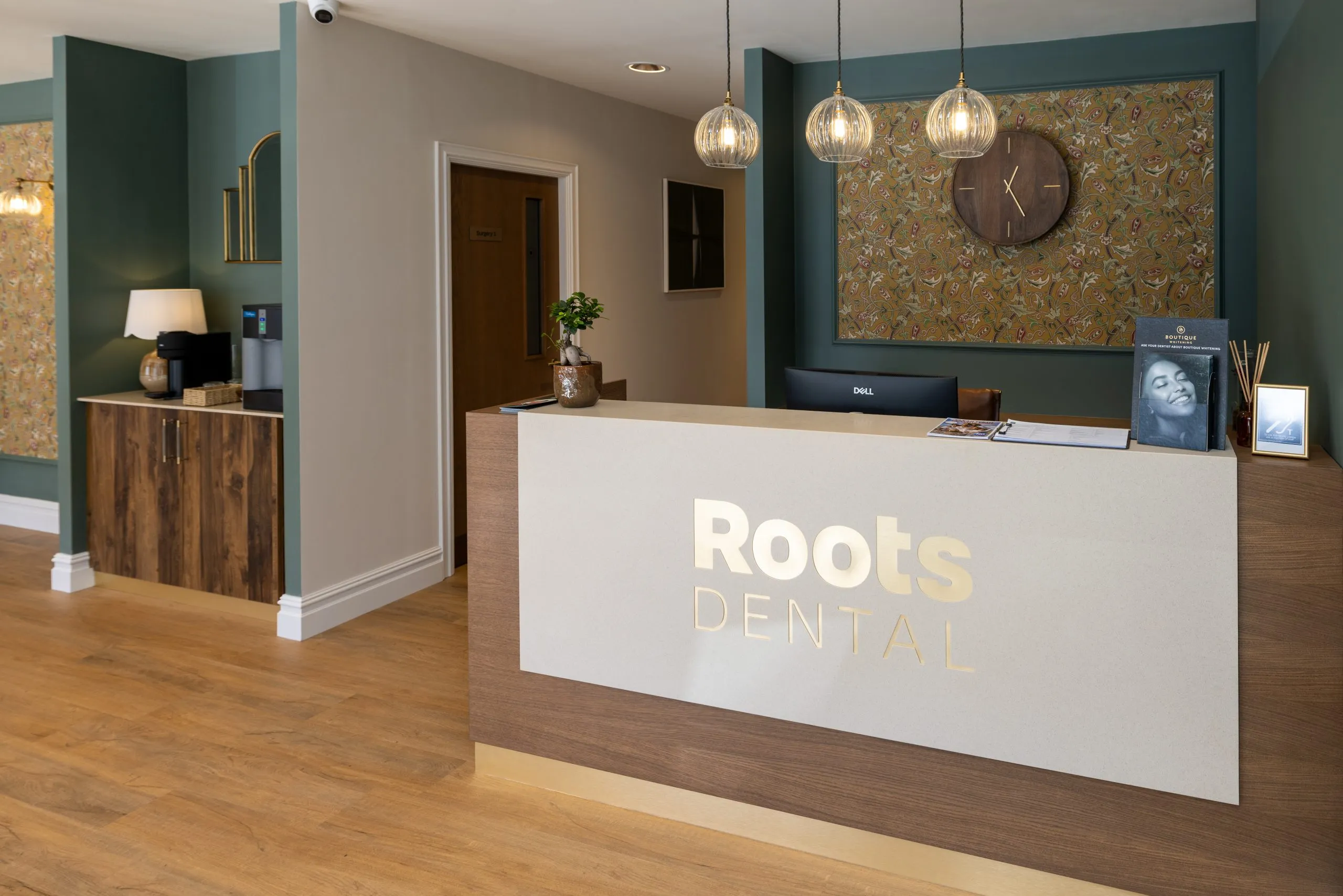 Backlit Roots Dental reception desk in Morpeth