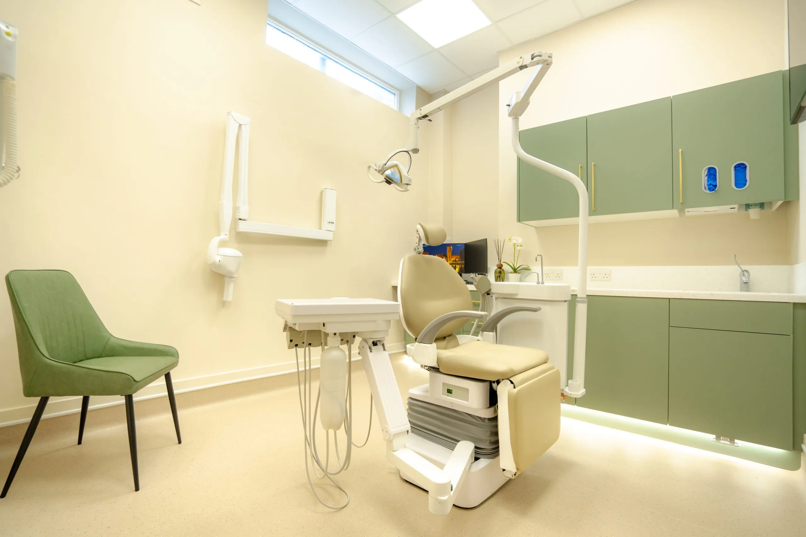 Dental surgery with skylight, green cabinetry and new equipment at Alma Dental, North Shields