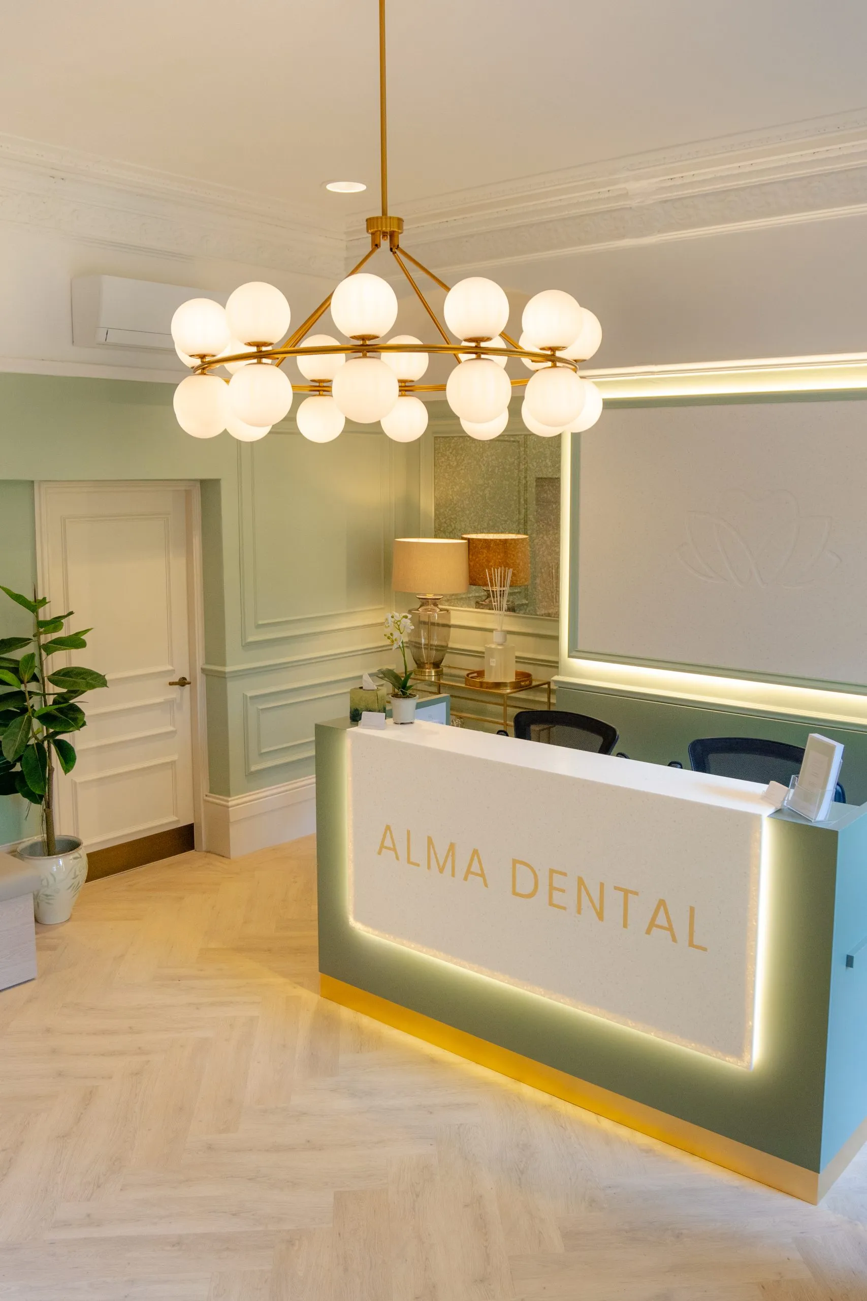 Backlit reception desk at Alma Dental, North Shields — a turn-key dental practice fit-out by BH Projects Group
