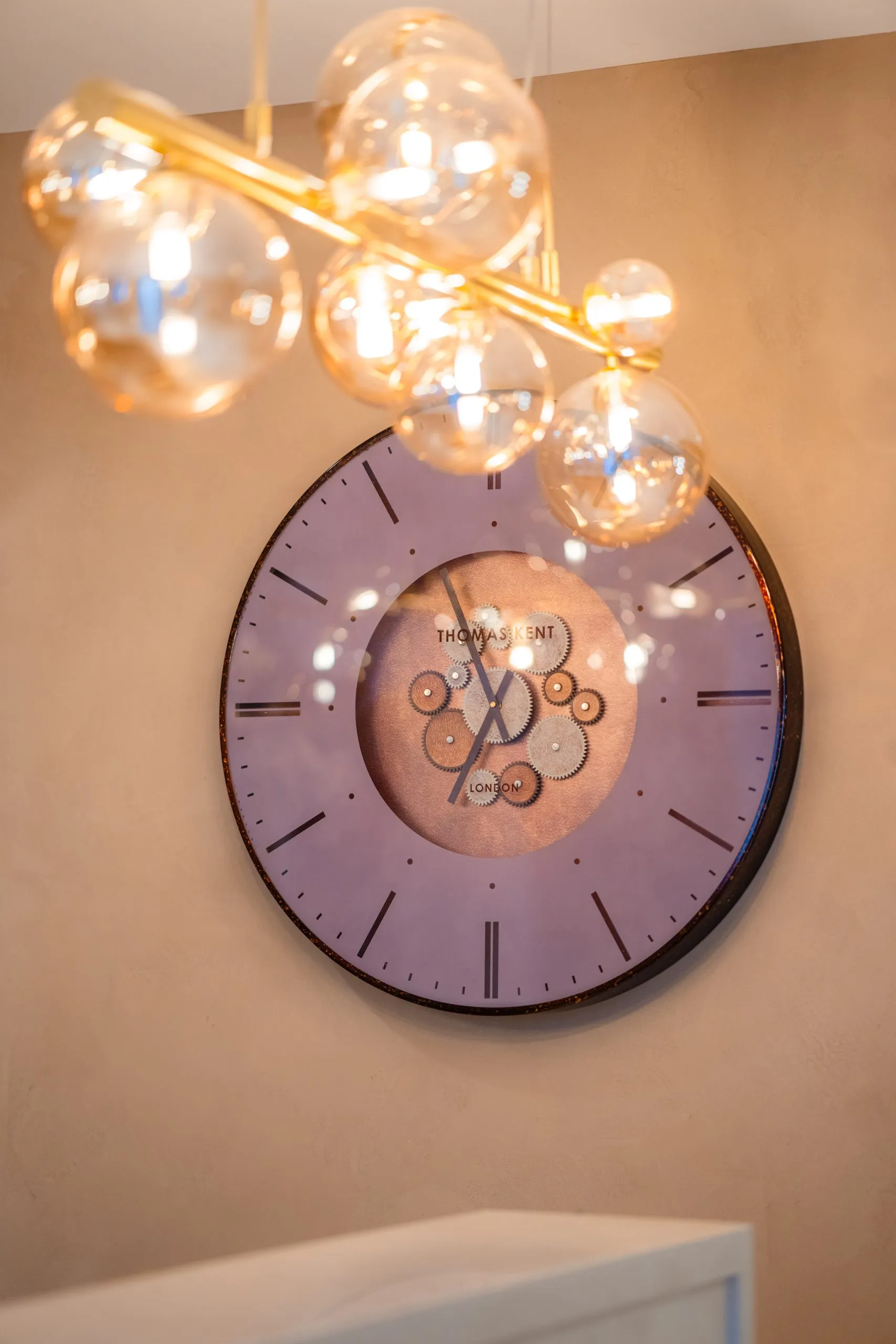 Statement wall clock and pendant lighting in the Bromsgrove Dental Specialists interior