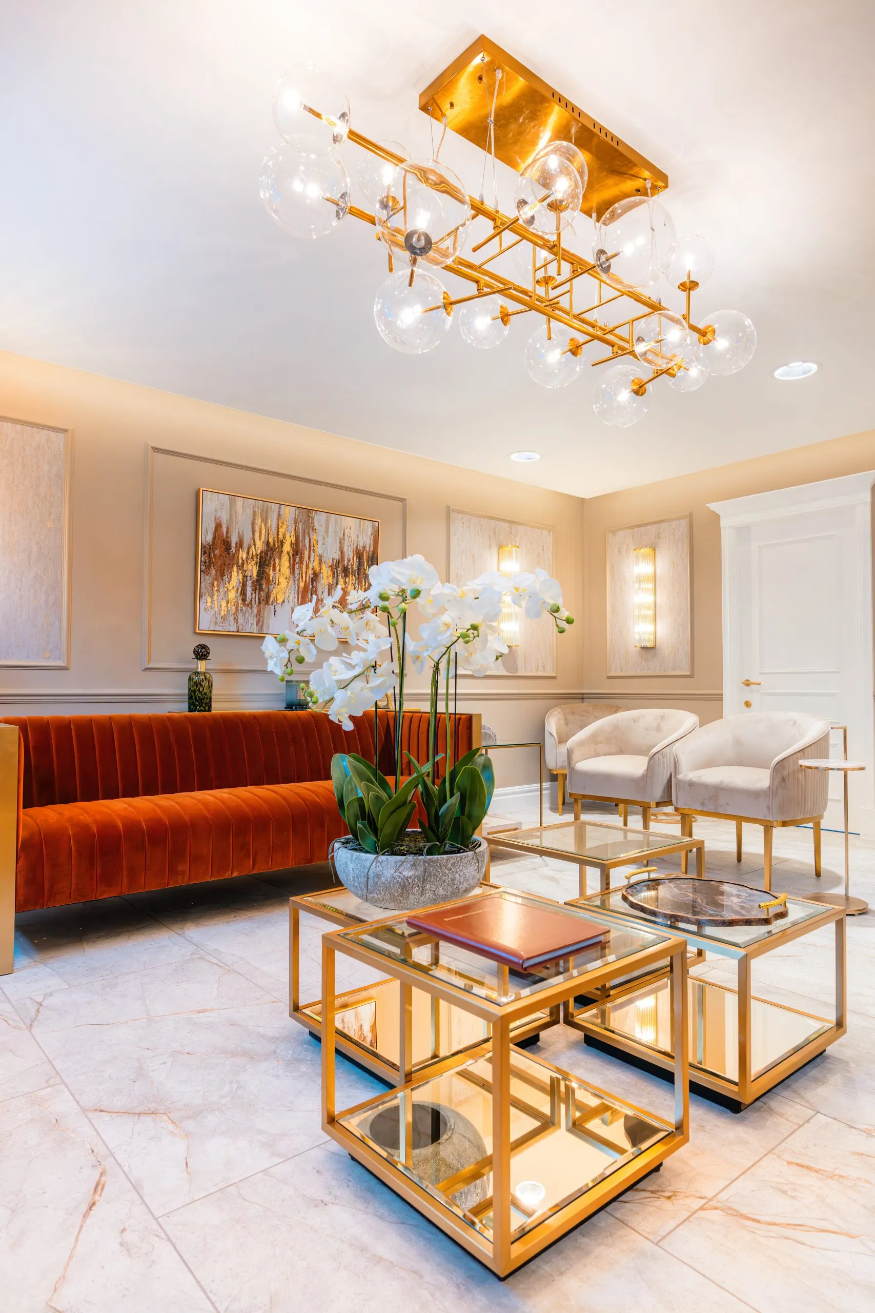 Waiting lounge with artwork and orchids at Bromsgrove Dental Specialists dental practice design
