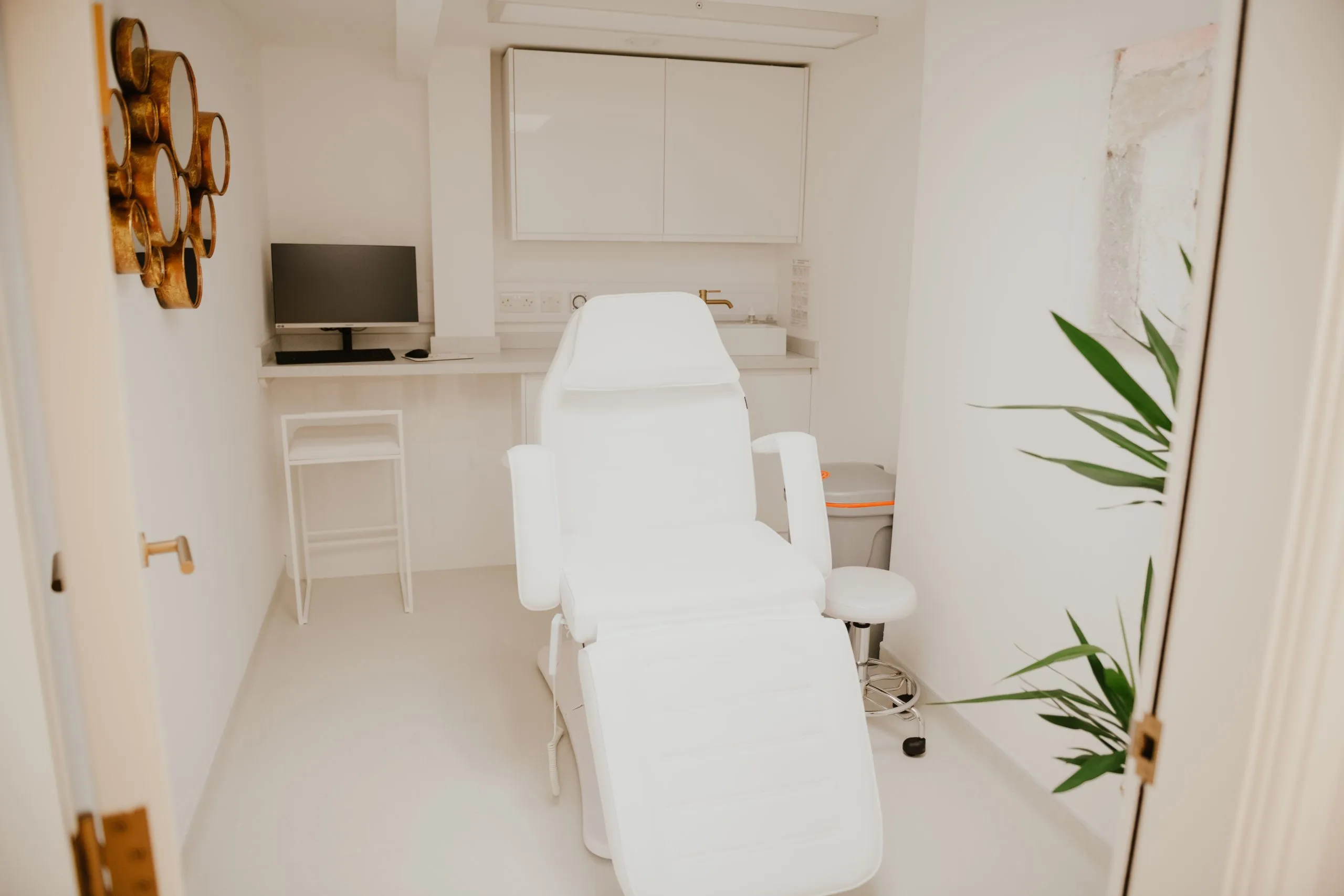 White treatment room with beauty chair at Blossom Cosmetic Clinic, York