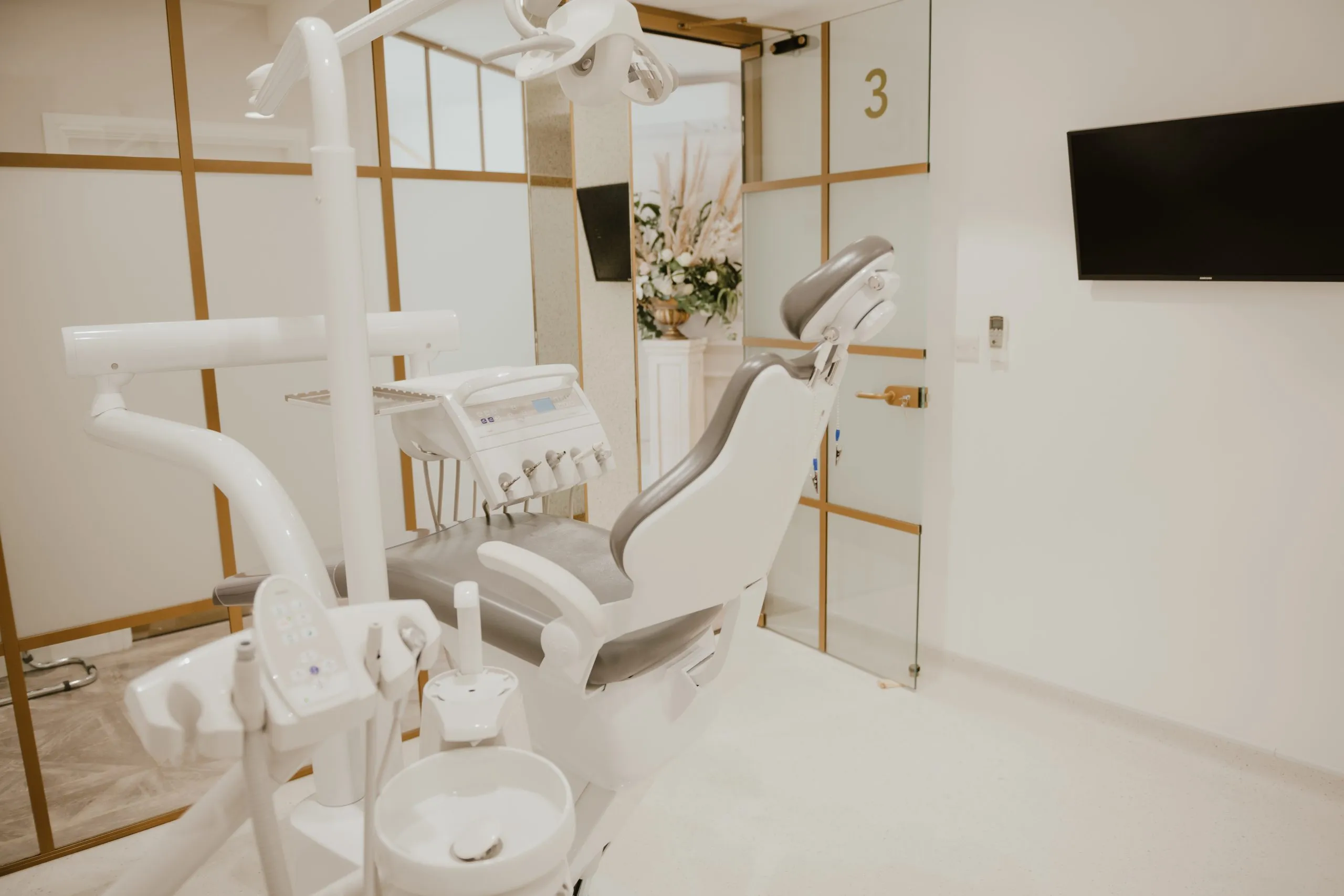 White and gold treatment room with new clinic chair at Blossom Cosmetic Clinic, York