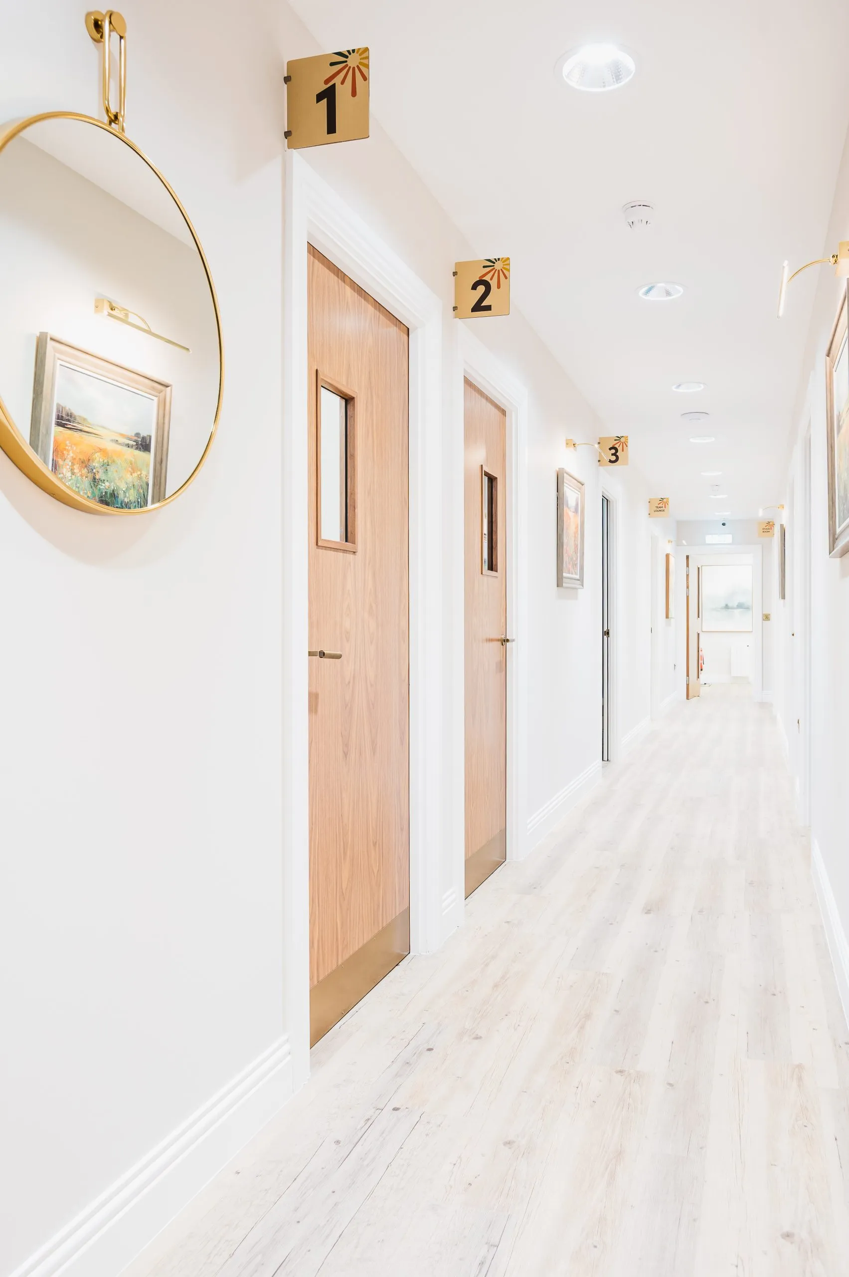 Corridor of numbered surgeries at Bright Orthodontics, Liverpool