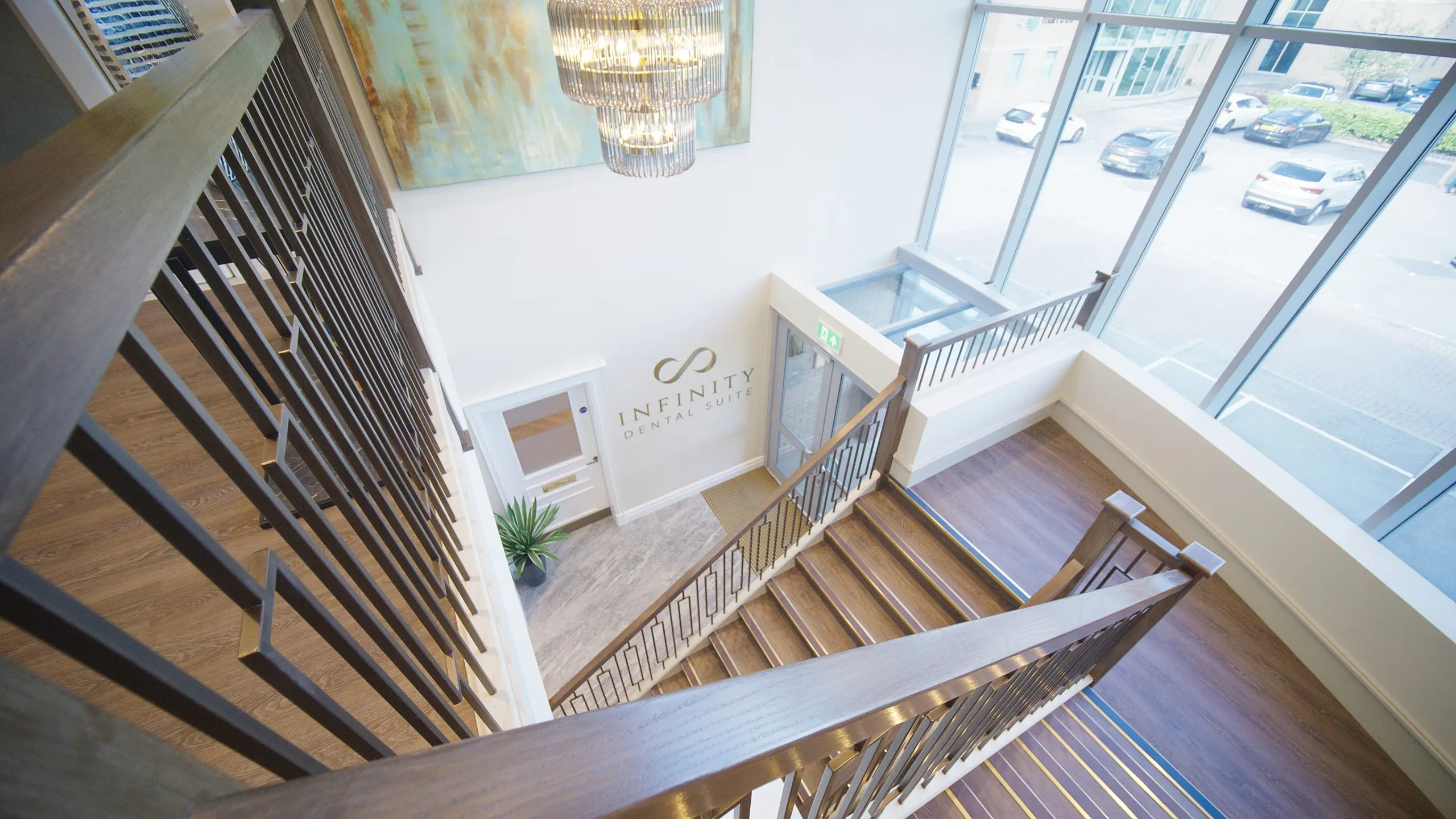 View down the bespoke staircase to the practice entrance at Infinity Dental Suite, Harrogate