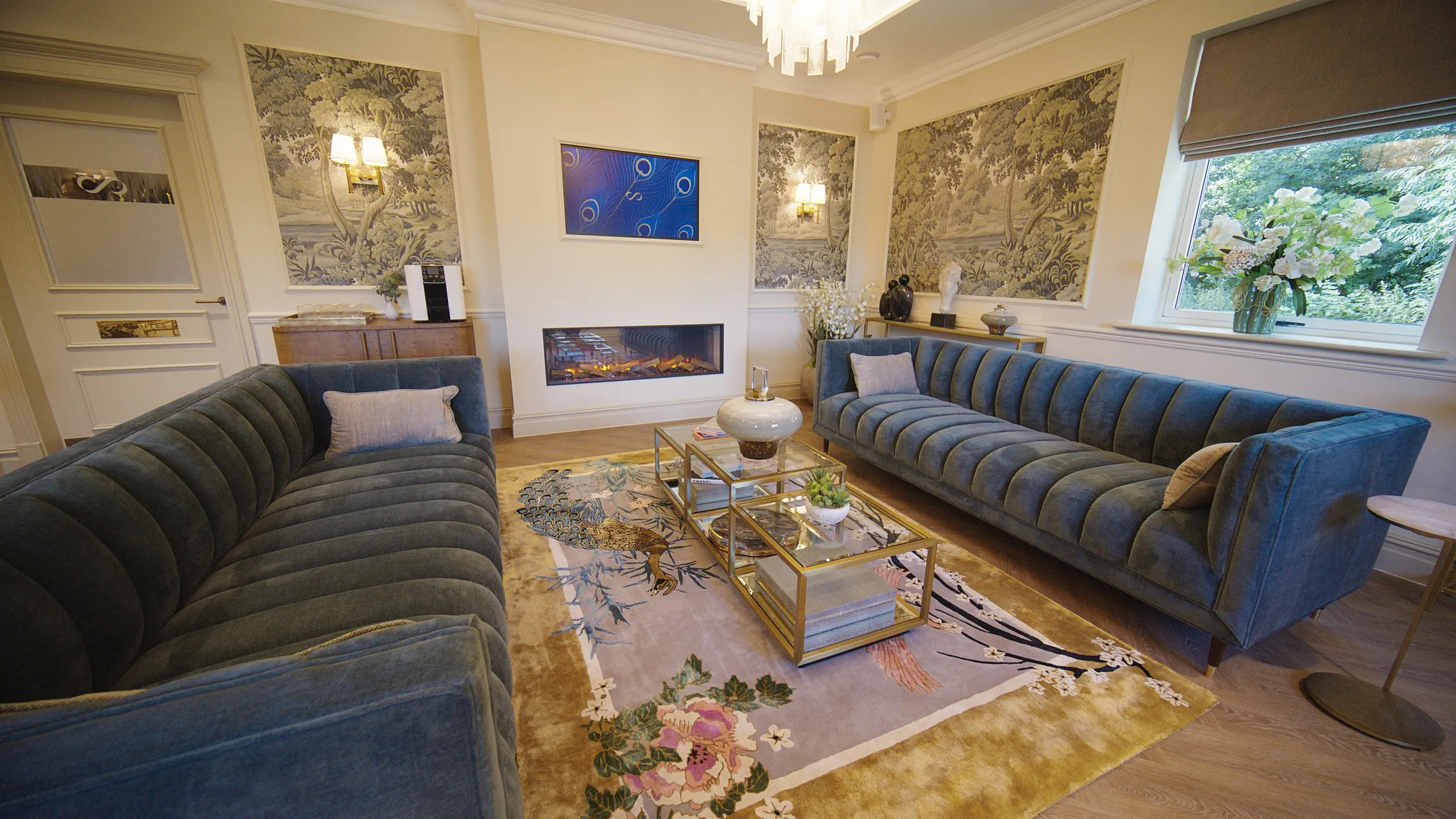 Patient lounge with navy sofas and botanical wallpaper at Infinity Dental Suite, Harrogate