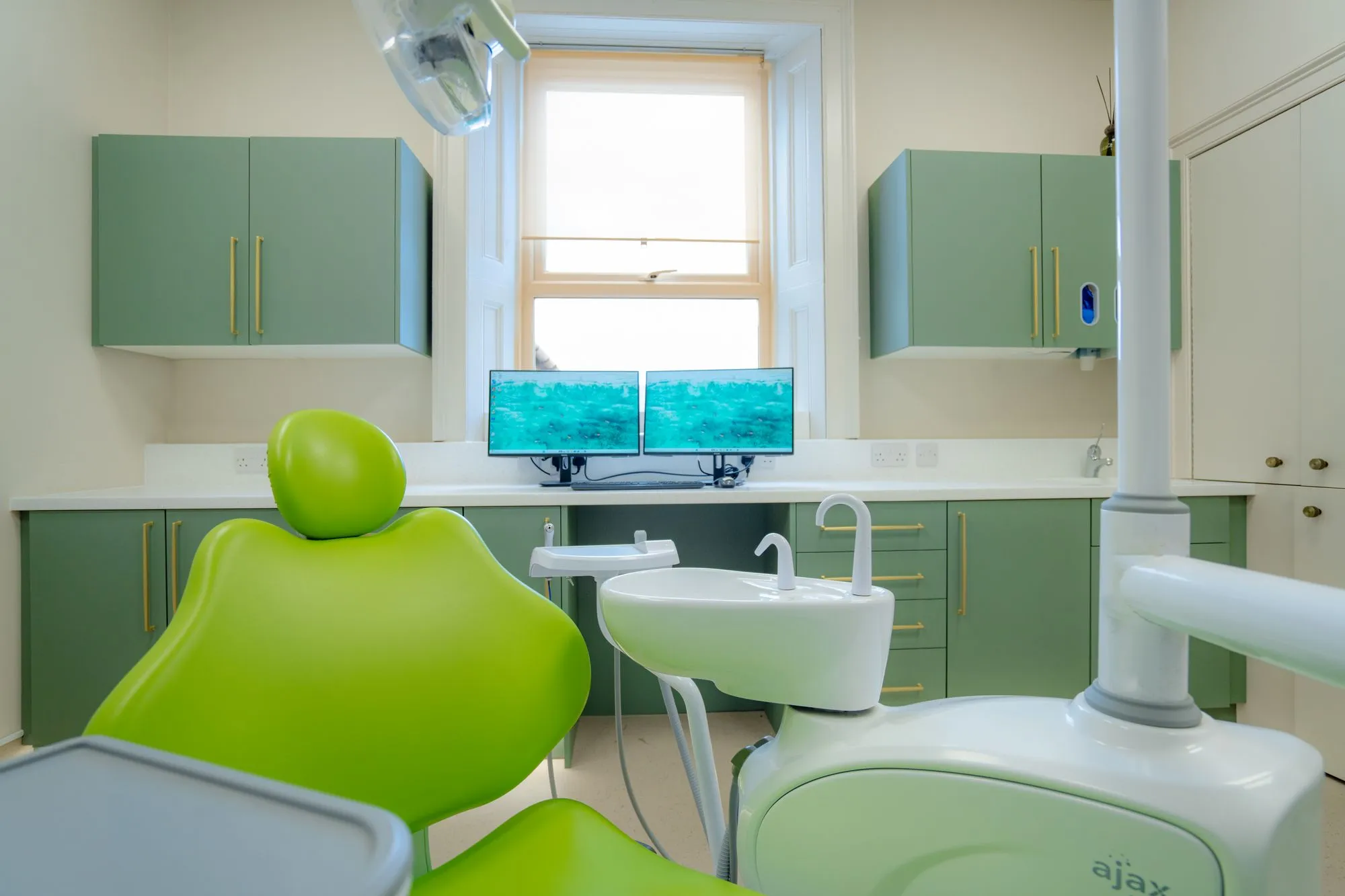 Sage-green surgery with new dental chair and skylight at Alma Dental, North Shields