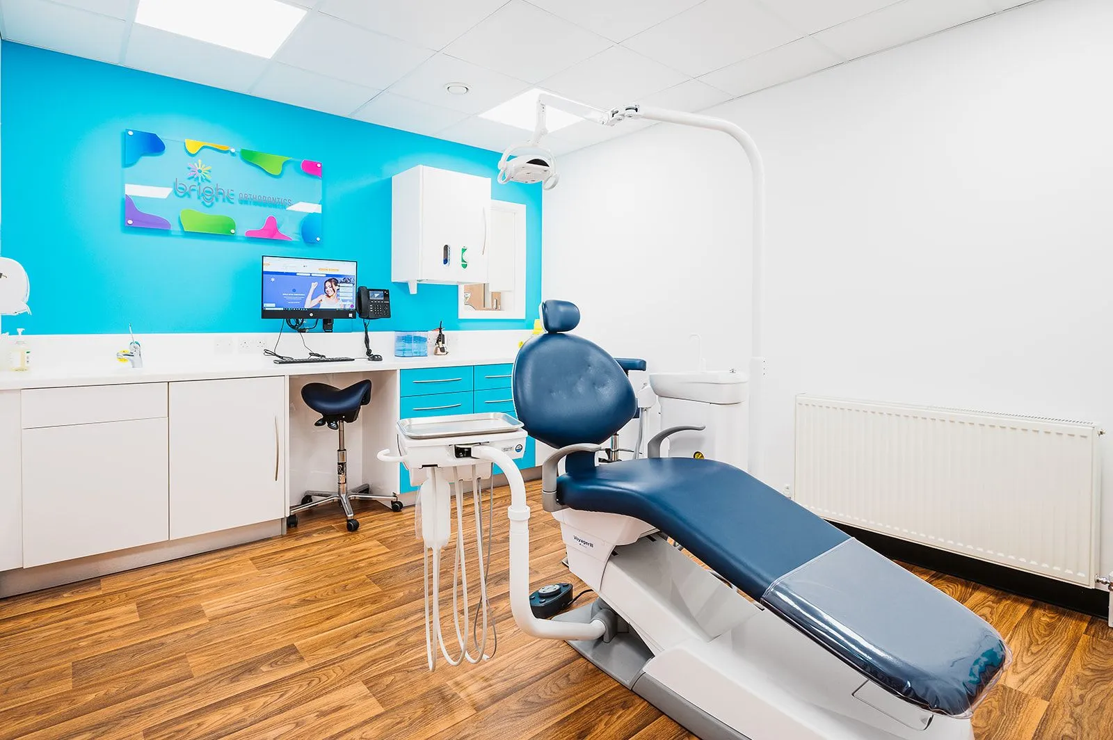 Orthodontic surgery with blue feature wall and treatment chair at Bright Orthodontics, Ormskirk