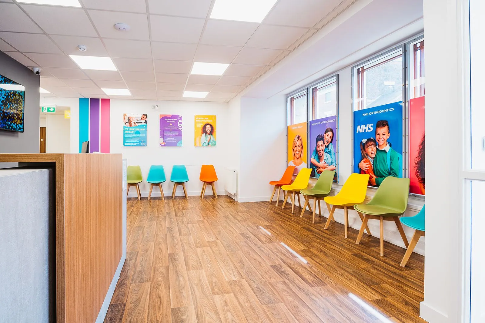 Bright waiting area with multicoloured chairs at Bright Orthodontics, Ormskirk
