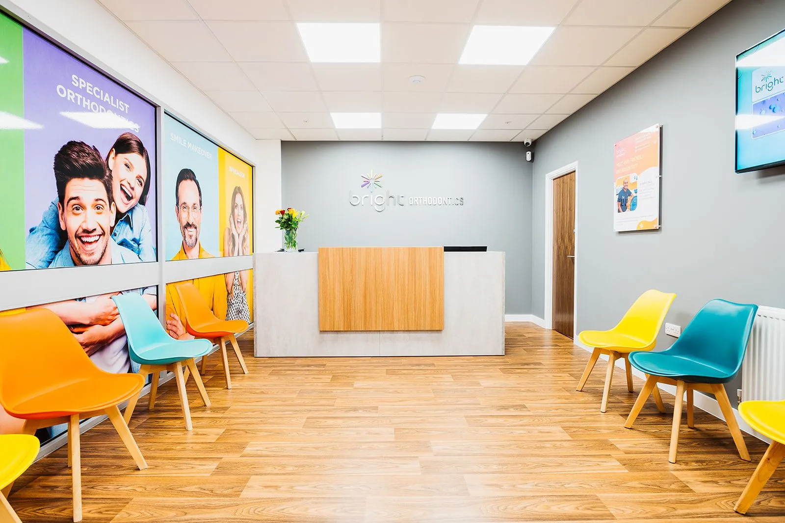 Reception and waiting area with yellow and teal seating at Bright Orthodontics, Skelmersdale