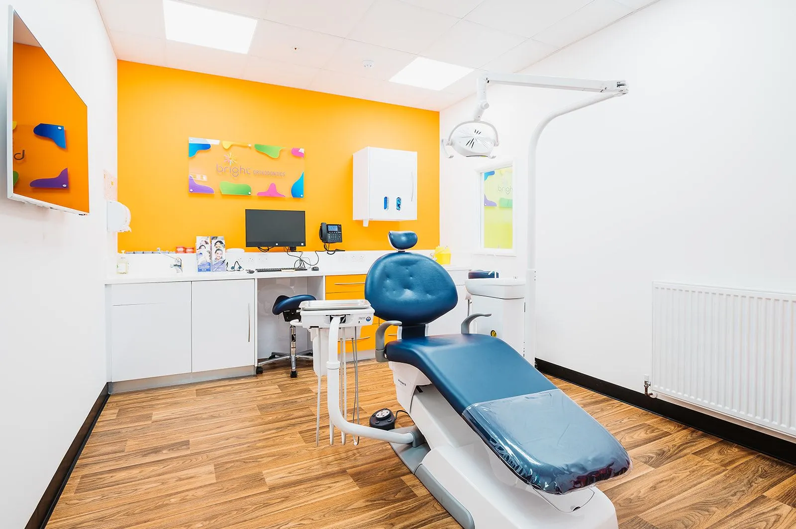 Orthodontic surgery with yellow feature wall at Bright Orthodontics, Skelmersdale